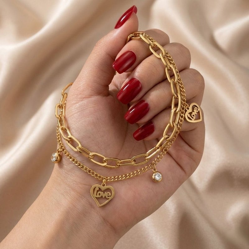 A gold bracelet made of rust-resistant stainless steel, with two layers of chains, heart-shaped pendants filled with the word Love with shiny stones, and an adjustable clasp to fit you. - Image 4